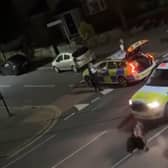 A still from a video uploaded by X account UB1UB2 West London (Southall) of a cow being rammed by a police car in Feltham on June 14, 2024 